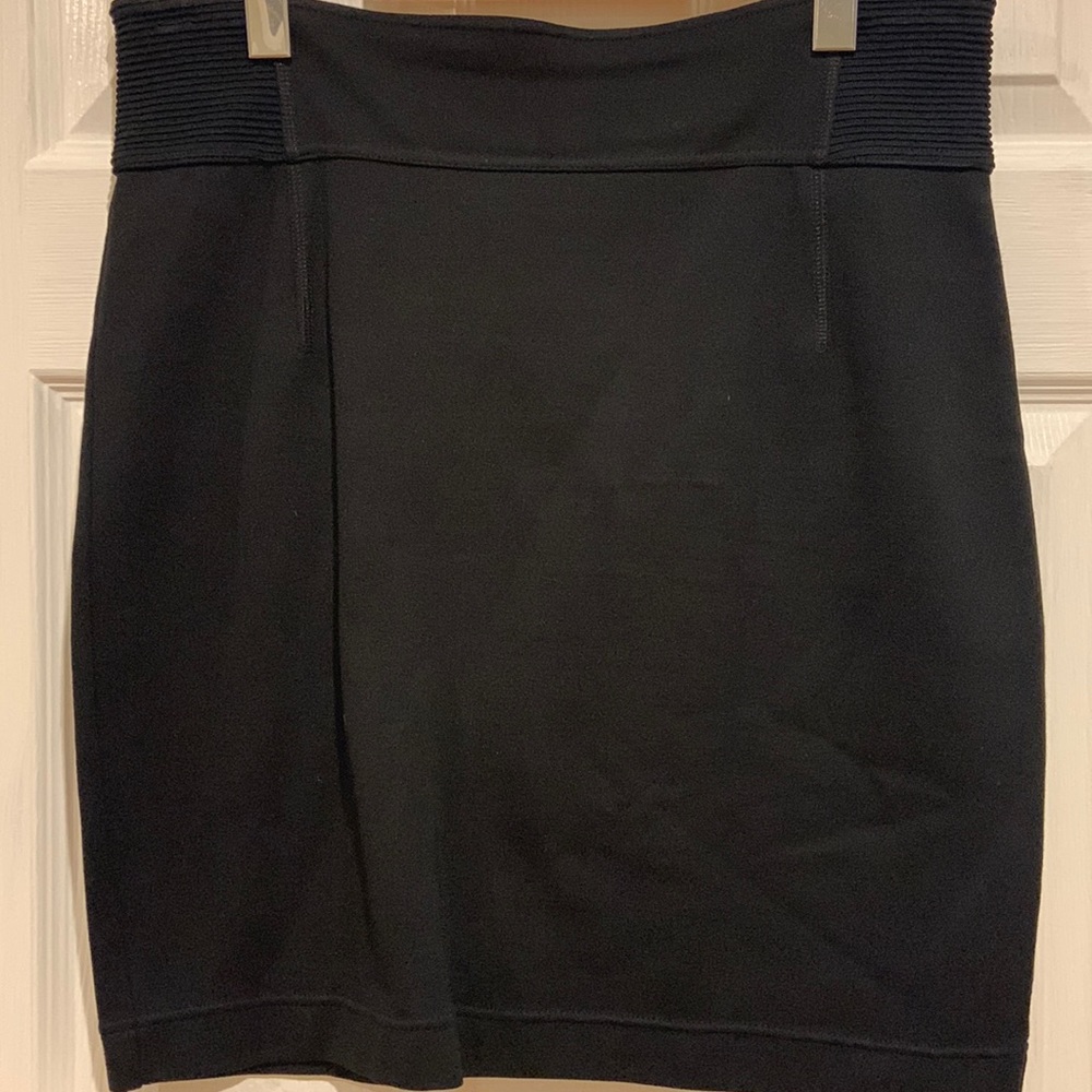 Black back zip skirt. Elastic at waist for comfortable fit. No signs of wear.